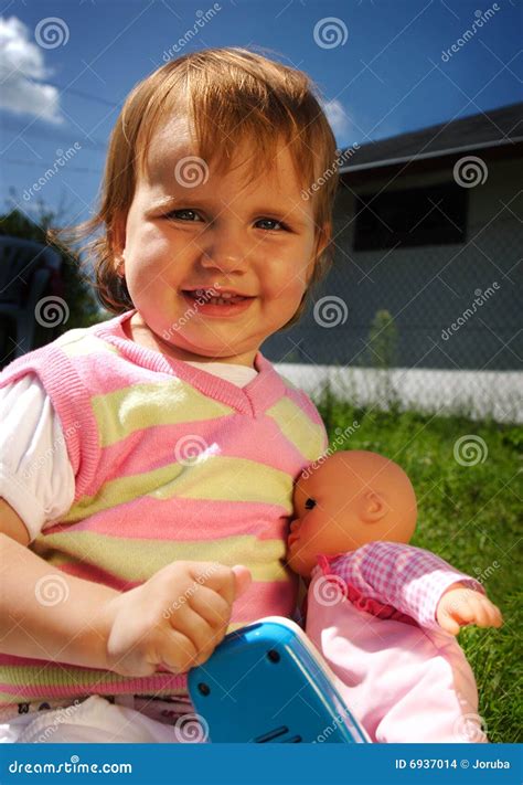 Smiling Child with Her Toys Outdoor Stock Photo - Image of cute, grass: 6937014