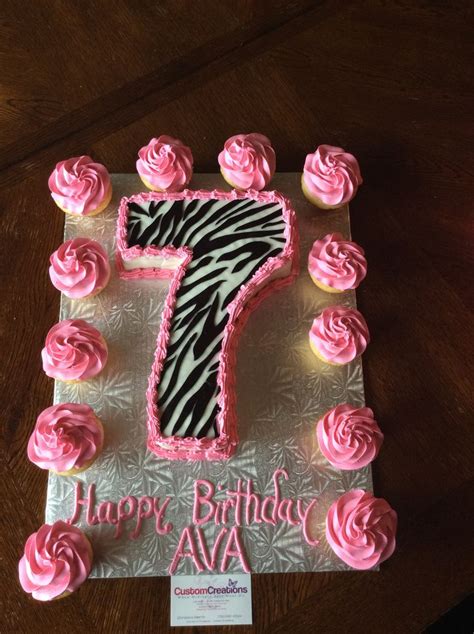 Chocolate number 7 cake with zebra print fondant. Pipes with hot pink icing. Vanilla cupcakes ...