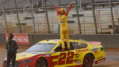 Joey Logano takes the checkered flag in a haze of Bristol dirt