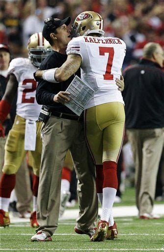 Jim Harbaugh celebrates with Colin Kaepernick (7) after a touchdown during the second half of ...