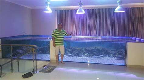 One of the largest aquariums I have ever seen in a home! It also looks like it is on the second ...