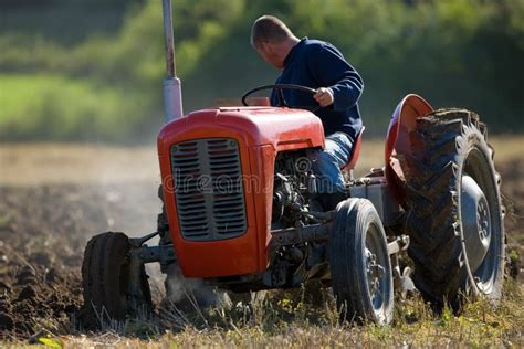 Tractor ploughing field stock photo. Image of plowing - 1980496