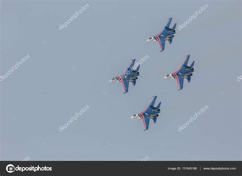 Fighter Sukhoi Su-27 show aerobatics at an airshow Russian Knights ...