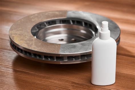 Rusty brake rotor and anti-rust spray on wooden table | Regional Services