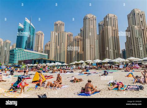 DUBAI, UAE - OCTOBER 21, 2016: People at Marina Beach in Dubai, United ...