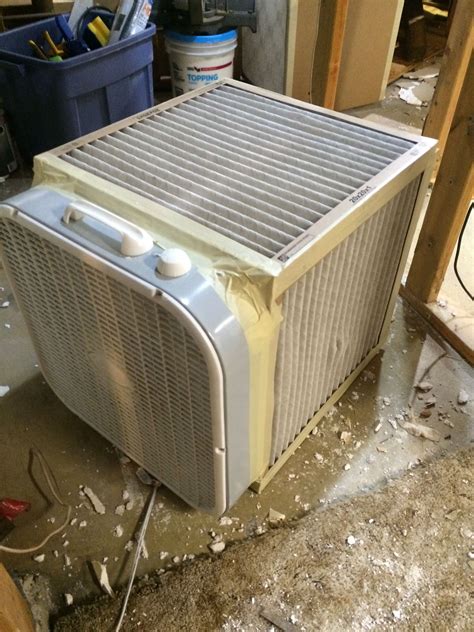 DIY air filtration. Just tape 5 20"x20" furnace filters to a box fan ...