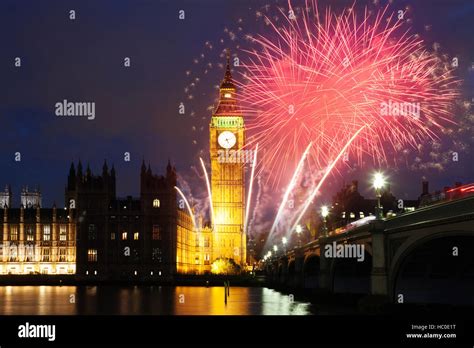 explosive fireworks display fills the sky around Big Ben. New Year's Eve celebration background ...