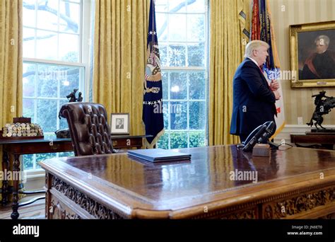 United States President Donald Trump stands in the Oval Office after speaking about trade at the ...