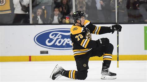 Charlie McAvoy's goal in season debut helps Bruins extend historic ...