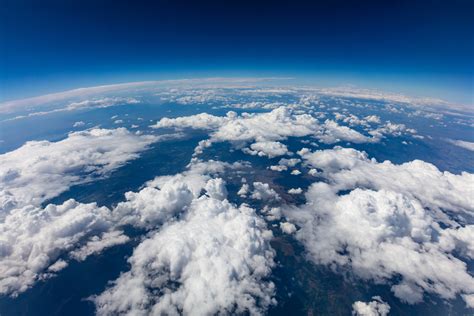 Curvature of planet earth. Aerial shot. Blue sky and clouds - ACRP