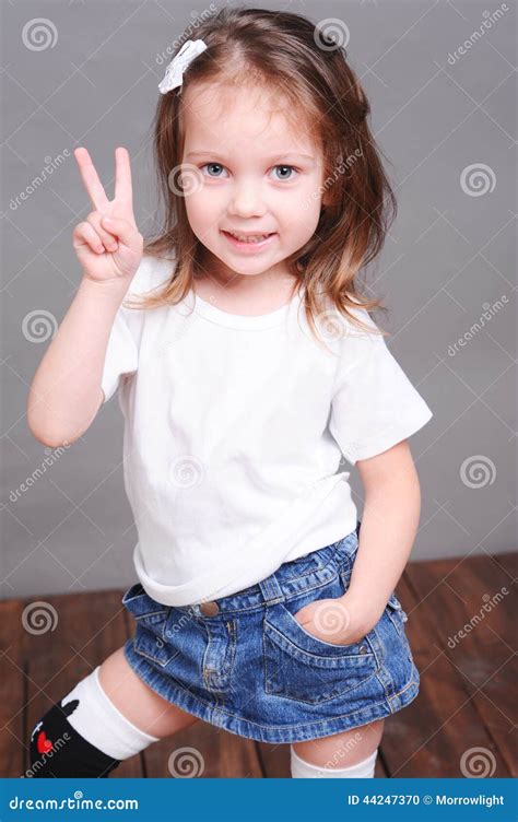 Smiling Baby Girl Posing On Gray Stock Photo - Image: 44247370