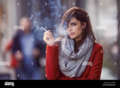 Ill bring the smoke, you bring the fire. Portrait of a beautiful and fashionable young woman ...