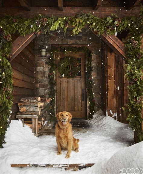 A golden retriever sits at the front door of this cozy Montana log ...