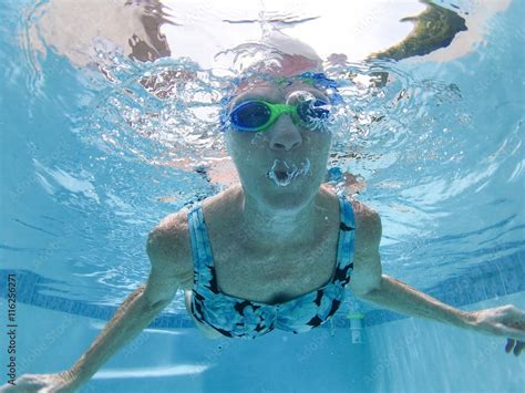 Blowing bubbles underwater Stock Photo | Adobe Stock