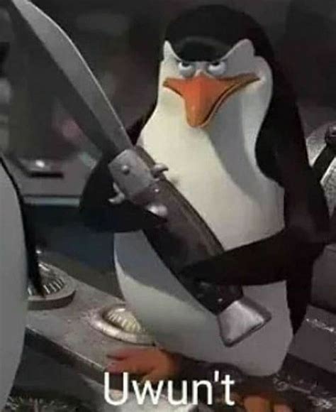 a penguin with a knife in its hand