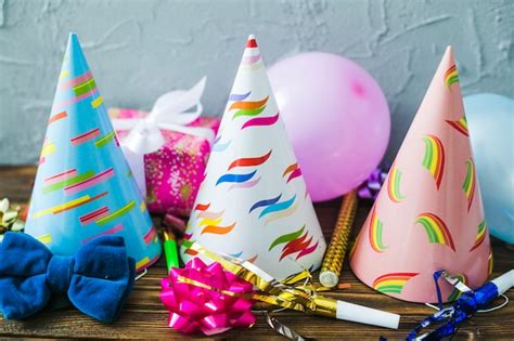 Free Photo | Assortment of party hats and balloons