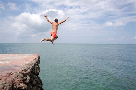 "Man Jumping Off Cliff Into The Ocean" by Stocksy Contributor "Jovo ...