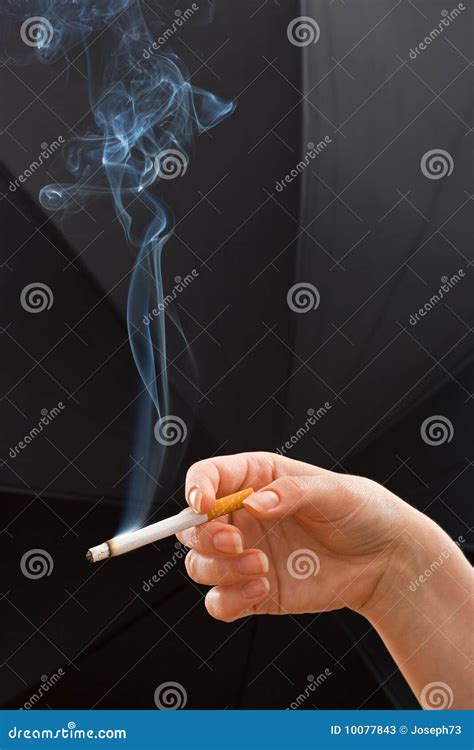 Woman Hand Holding A Cigarette Stock Photos - Image: 10077843