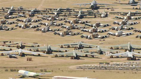 HD stock footage aerial video of reverse view of military airplanes at an aircraft boneyard ...