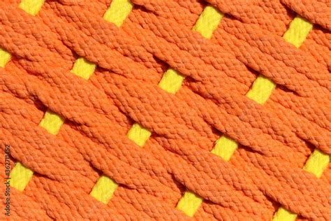 Ropes weave texture in orange color with yellow line cut through ...