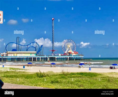 Galveston Island Historic Pleasure Pier and beach Stock Photo - Alamy