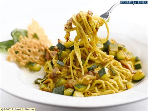 Homemade Tagliolini Pasta Sautéed With Bacon, Zucchini And Saffron by Ristorante Bologna