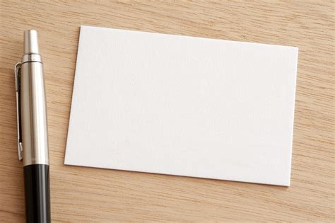 Free Stock Photo 12721 Blank white business card with pen | freeimageslive