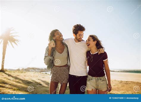 Young People Walking Together Outdoors Stock Photo - Image of happy, walking: 124631600