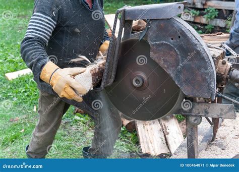 Cutting firewood. stock image. Image of orange, wheel - 100464871