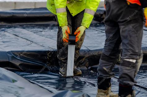 Premium Photo | Ground floor waterproofing membrane installation on new house