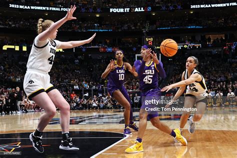 Gabbie Marshall of the Iowa Hawkeyes knocks the ball away from Alexis ...