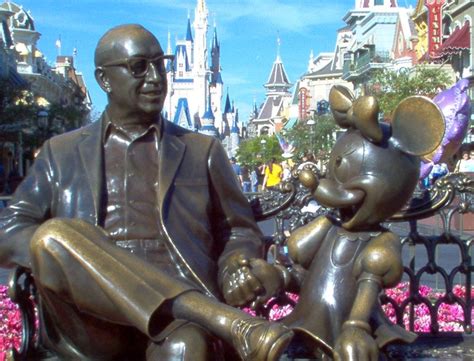 Closeup of the statue of Roy O. Disney holding Minnie's hand, located ...