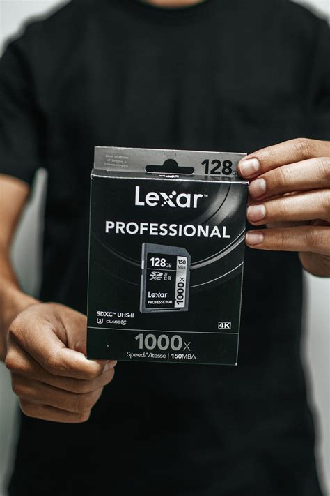 Person Holding Lexar Professional Memory Card Box · Free Stock Photo