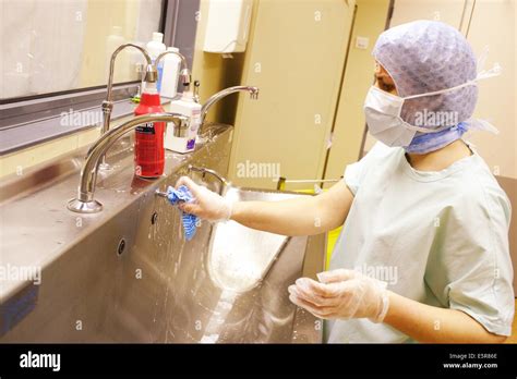 Hospital cleaning staff disinfecting operating room Stock Photo ...