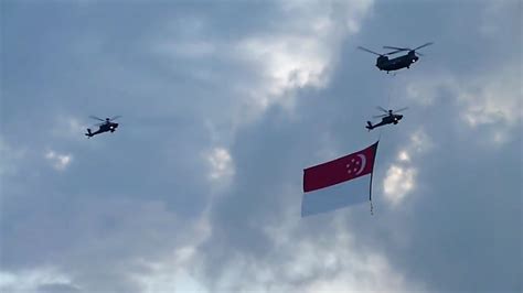 Singapore National Day 2010: CH-47 helicopter with flag, accompanied by ...