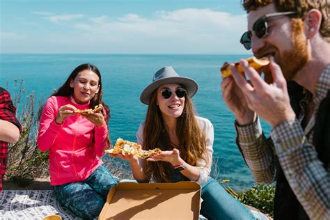 Happy People Eating Pizza Together · Free Stock Photo