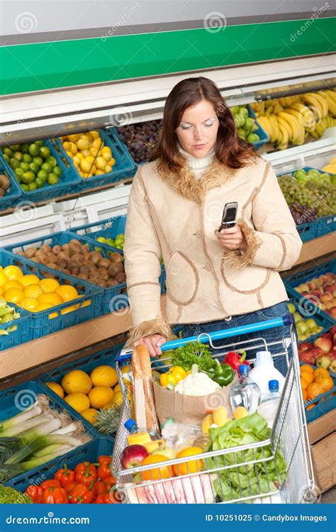 Grocery Store - Woman in Winter Outfit Stock Image - Image of celery, brunette: 10251025