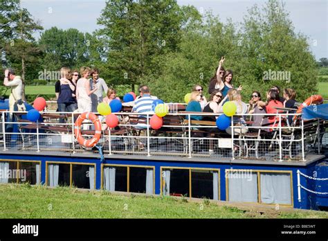 People enjoying a river boat party on the river Thames at Wallingford ...