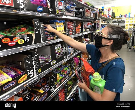 A shopper, Holly Tippet, picks out halloween candy at Dollar General in ...