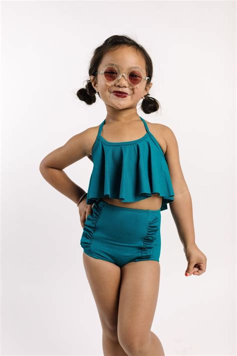 Mini Down in Front Ruffle Bottoms | Little girl swimsuits, Ruffled bottoms, High waisted ...