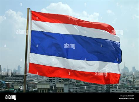 Thai flag flying in Bangkok, Thailand Stock Photo - Alamy