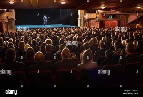 Audience watching performer on stage in theater Stock Photo: 66802125 - Alamy