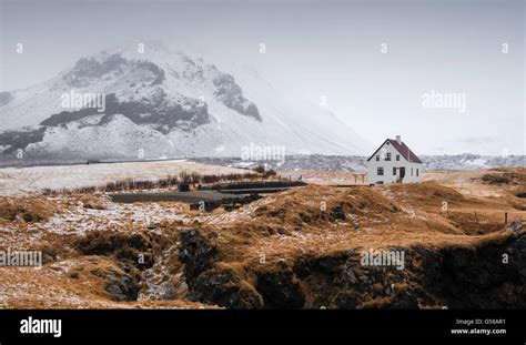 Icelandic winter landscape with a white small beautiful house under the ...