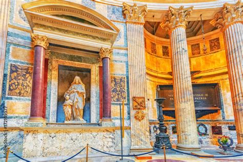 Inside interior of the Pantheon, is a former Roman temple, now a church, in Rome with tourists ...