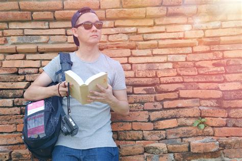 Man Holding Book Outdoor · Free Stock Photo