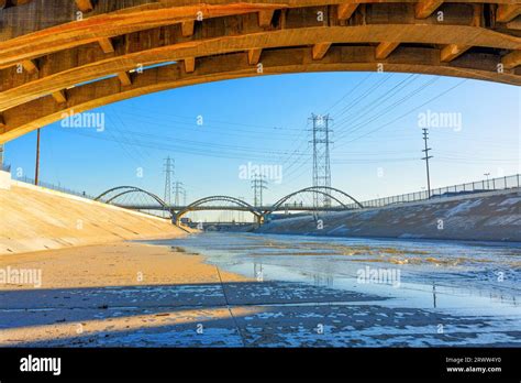 Wide angle view of thee Los Angeles River with bridges and power lines ...