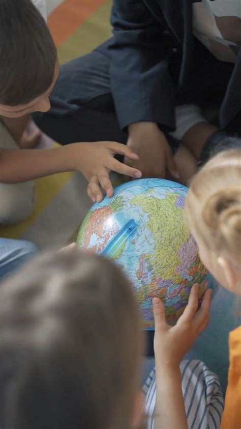 Children Checking the Globe · Free Stock Video