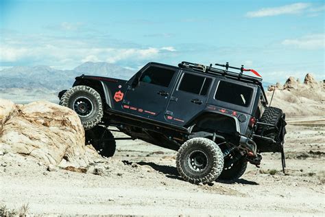 Black Lifted Jeep Wrangler Customized for Active Lifestyle Carrying Rhino Rack Bike Rack — CARiD ...