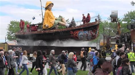 Giant puppets parade through Montreal - YouTube