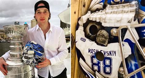 Andrei Vasilevskiy takes photo holding new Stanley Cup champions goalie ...